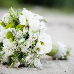 a photo of a wedding bouquet on the ground